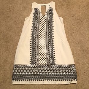 Sleeveless white peasant print shift dress